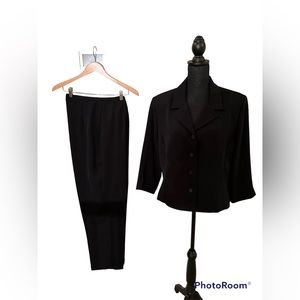 Simple black summer suit. In excellent condition.